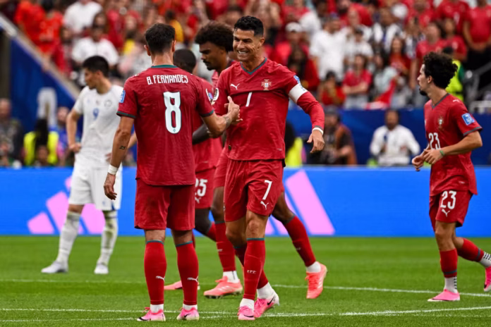 Cristiano-Ronaldo-of-Portugal-celebrates-with-team-mate-Bruno-Fernandes-on-June-23-2026